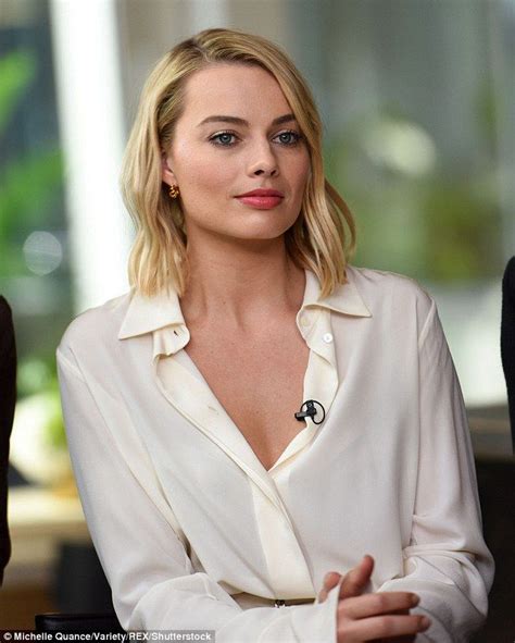 margot robbie is sophisticated chic in all white ensemble margot robbie margot robbie hot