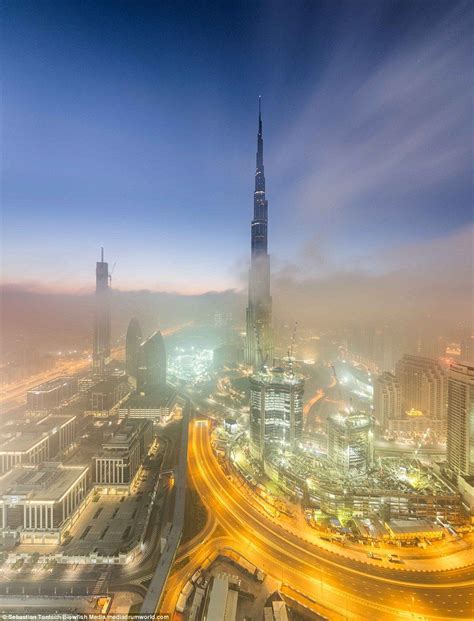 Incredible Photos Show Dubais Dazzling Skyline Above The Fog Burj