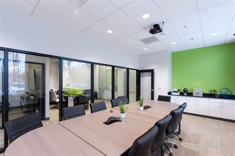 Conference Room With Green Accent Wall Built In Millwork Black Framed
