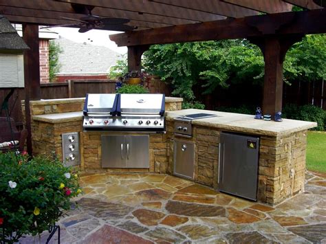 With an outdoor timber frame structure, an outdoor kitchen can be built on an existing patio or built from the ground up. Stacked Stone Outdoor Kitchen With Pergola | Outdoor ...