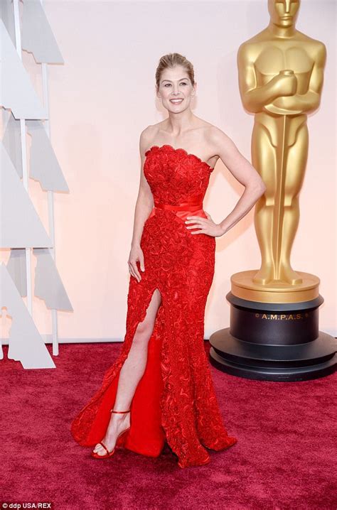 Rosamund Pike Shows Off Her Tiny Waist In A Radiant Red Gown At The