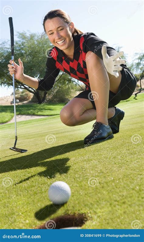 Golfer With Ball Rolling Towards Cup Stock Image Image Of Freetime