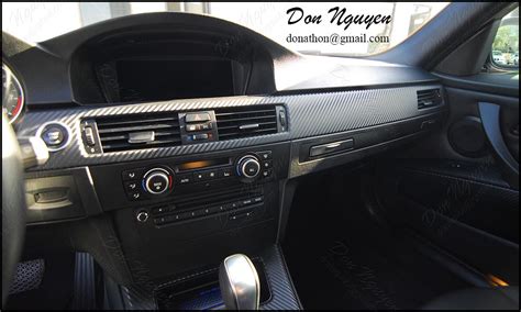 Trim the edges with a sharp blade to remove excess vinyl wrap. BMW E92 335i Coupe - Matte Carbon Fiber Interior Vinyl ...