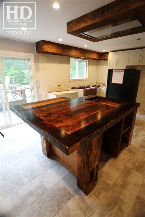 Any material that has an organic influence helps to ground the room and provide an instant sense of calm, and reclaimed wood is warm and full of rich detail. Reclaimed Wood Kitchen Island | HD Threshing Floor Furniture