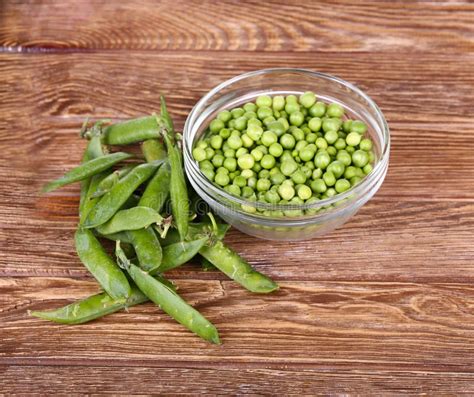 Green Peas Fresh From The Garden In Wooden Bowl Stock Photo Image Of