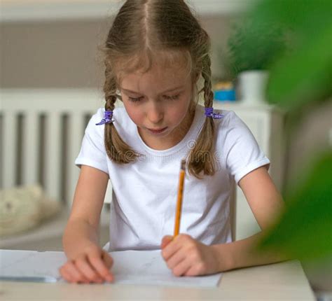 Cute Little Girl Doing Her Homework Stock Photo Image Of Notebook