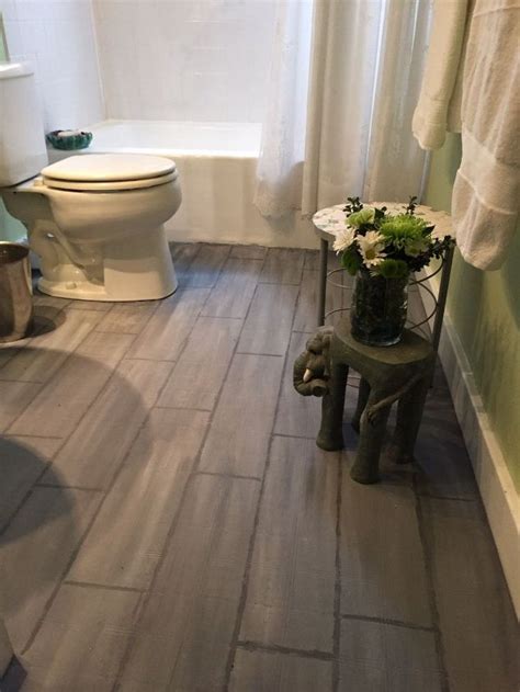 Stunning bathroom floor composed of marble basketweave tiles and subway tile baseboard. Bathroom Floor Tile or Paint? | Hometalk