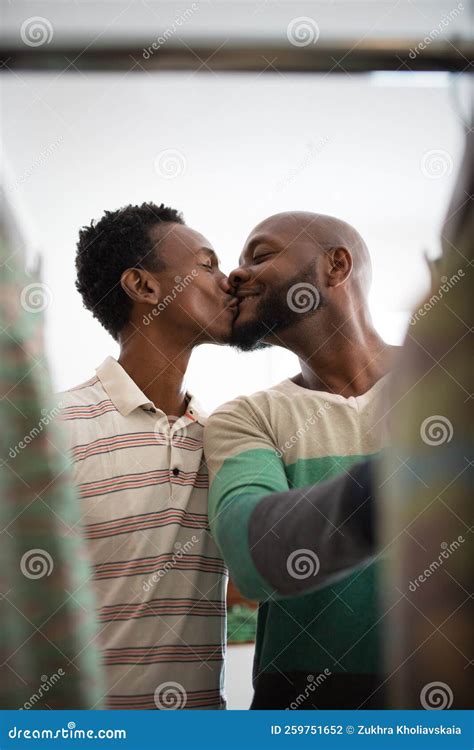 Close Up Of African American Gay Couple Having Fun With Kisses Stock