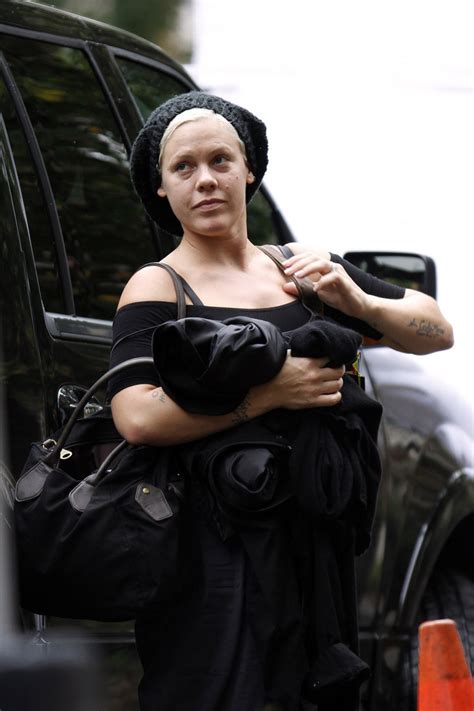 Singer pink was born with the name alecia beth moore. Pink Photos Photos - Pink With Her Husband Carey Hart and ...