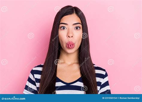 Photo Of Funny Young Lady Tongue Out Wear Striped T Shirt Isolated On Pastel Pink Color