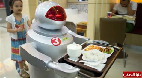 بالصور مطعم صيني يوظف الروبوتات للقيام بعمل النادل