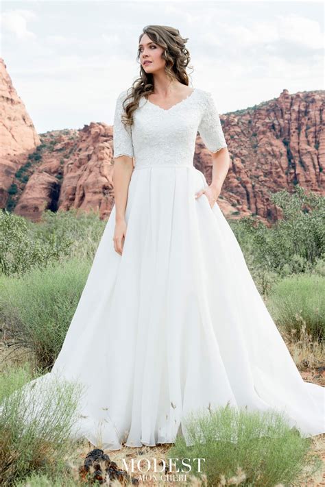 This Modest Bridal By Mon Cheri Tr12025 A Line Bridal Gown Features A