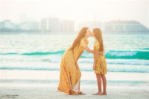 Premium Photo Beautiful Mother And Daughter At The Beach Enjoying