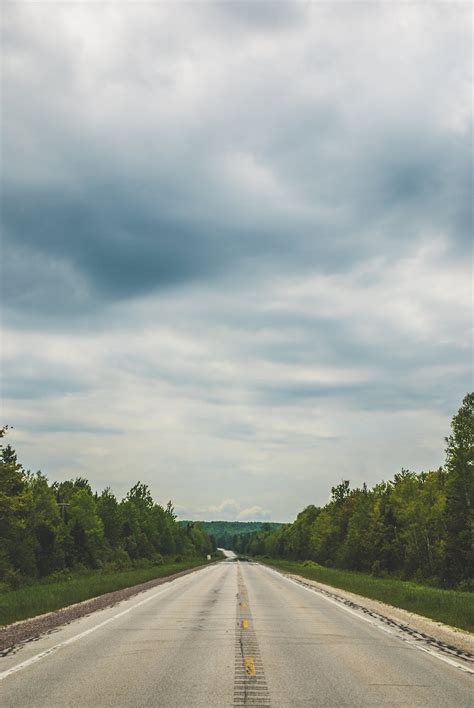 Empty Blacktop Road Under Cloudy Sky · Free Stock Photo