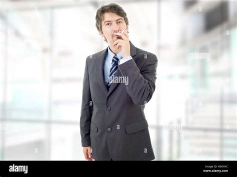 Businessman Smoking At The Office Stock Photo Alamy