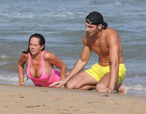 Karen Danczuk Flashes Her Cleavage As She Lays On The Sand Karen Danczuk Packs On The Pda With