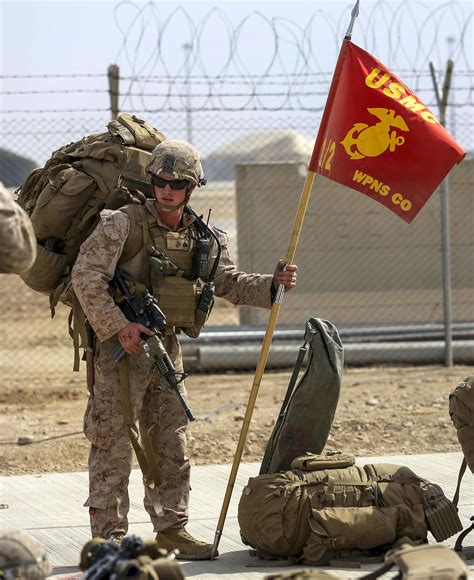 Us Marine Corps Sgt William Galentine Holds A Units Guidon While