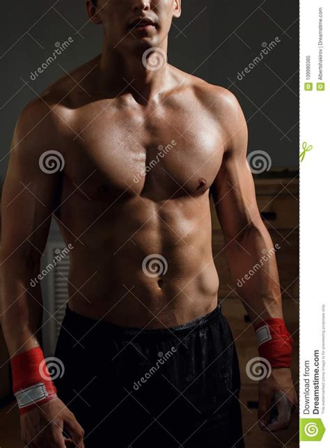 Man With Muscular Torso Showing Six Pack Abs Stock Image
