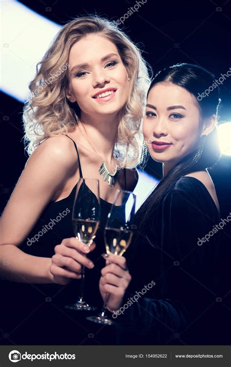 Multicultural Glamour Girls With Champagne Stock Photo
