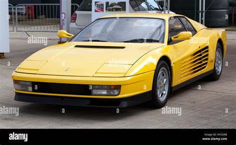 Three Quarter View Of A Yellow Ferrari Testarossa On Display At The