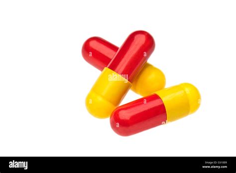 Three Red Yellow Capsules Over White Two As A Stack Stock Photo Alamy