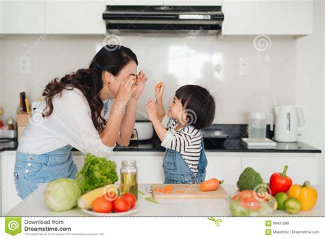 Mother With Her Daughter In The Kitchen Cooking Together Stock Image Image Of People Love