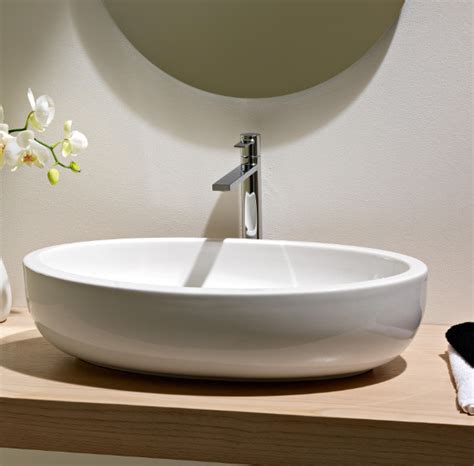Above counter bathroom sinks are often referred to as a vessel sink. Beautiful Oval Above Counter Vessel Bathroom Sink by ...