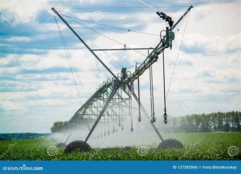 An Irrigation Pivot Watering A Field Beautiful View Stock Photo