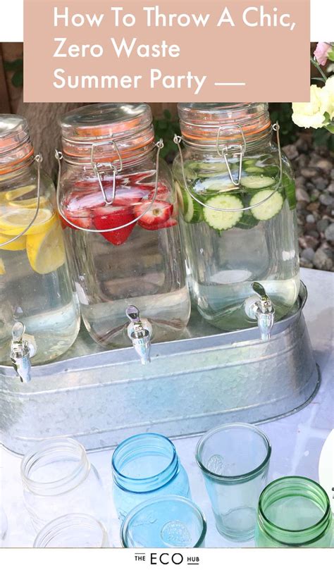 Mason Jars Filled With Lemons Cucumbers And Water Are On A Table