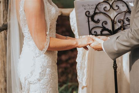 Bride And Groom Holding Hands During Ceremony