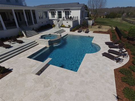 Inground Pool With Spa And Ivory Travertine Coping And Decking