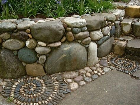 I have laid some river rock matting, in my shower floor, i will. River stone and boulder planter edge | Rock retaining wall ...