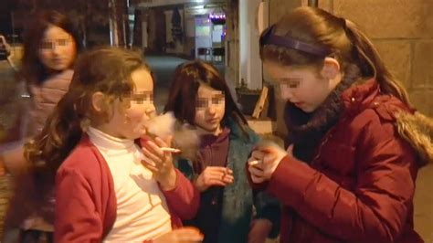Parents Encourage Their Children To Smoke Cigarettes In A