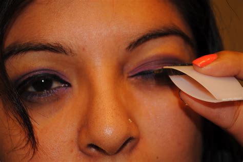 Applying eyeliner on your upper eyelid, draw an arrow about a centimeter beyond the outer corner. You Had Me at Makeup: How to Apply False EyeLashes