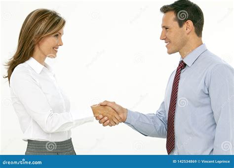 Two Successful Beautiful Corporate Business People Shaking Hands Stock