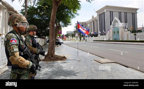 Heavily Armed Cambodian Police Special Force Officers Stands Guard In Front Of The Peace Palace