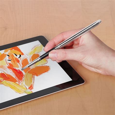 A Person Is Drawing On An Ipad With A Pen And Tablet Pc In Their Hands