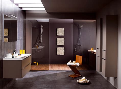 An elegant bathroom design including dark vanity, white countertops, and luxury decor accents. Modern Bathroom Designs from Schmidt
