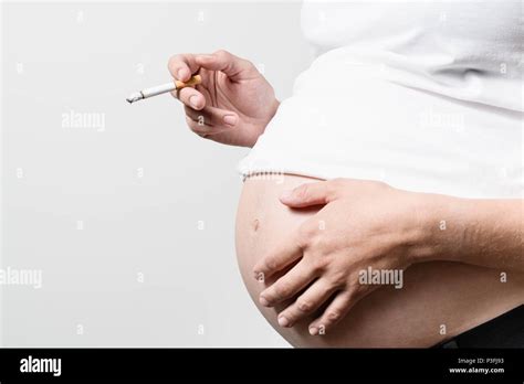 Pregnant Woman Smoking Cigarette Stock Photo Alamy