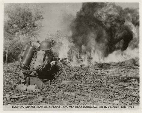 Us Army Soldier Firing A Flamethrower Against Japanese Forces Near