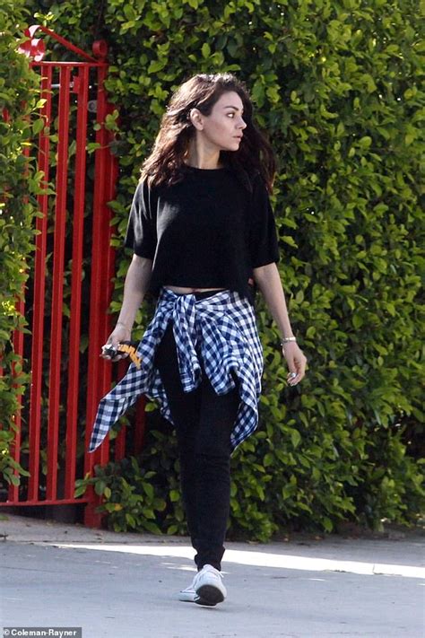 Mila Kunis Embraces Her Low Key Style As She Gives Peek At Her Tummy In Black Tee And Leggings