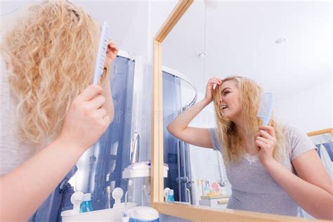 woman brushing her wet blonde hair stock image image of long blonde 159863331