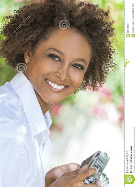 Mixed Race African American Girl Outside With Camera Stock Image