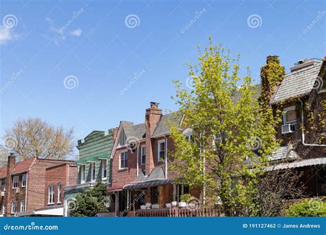 Row Of Old Brick Homes In Astoria Queens New York During Spring