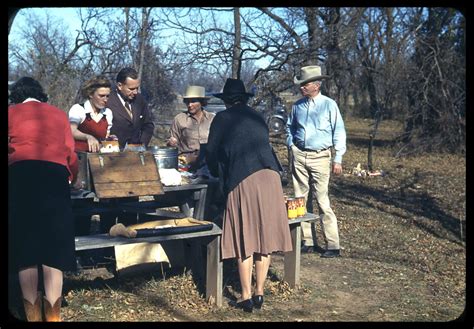 Men And Women Around An Outdoor Picnic Table Side 1 Of 1 The