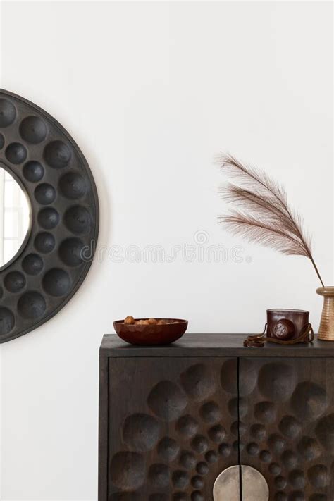 Interior Design Of Ethnic Living Room With Modern Commode Round Mirror