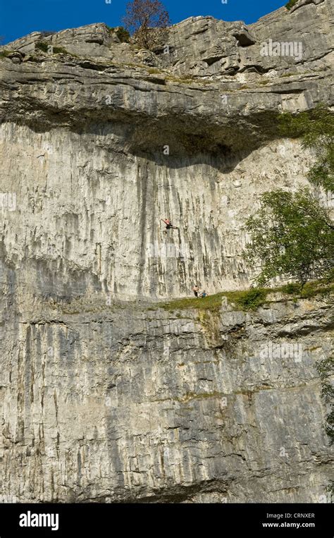 People Rock Climbing On Malham Cove A Spectacular Limestone Crag