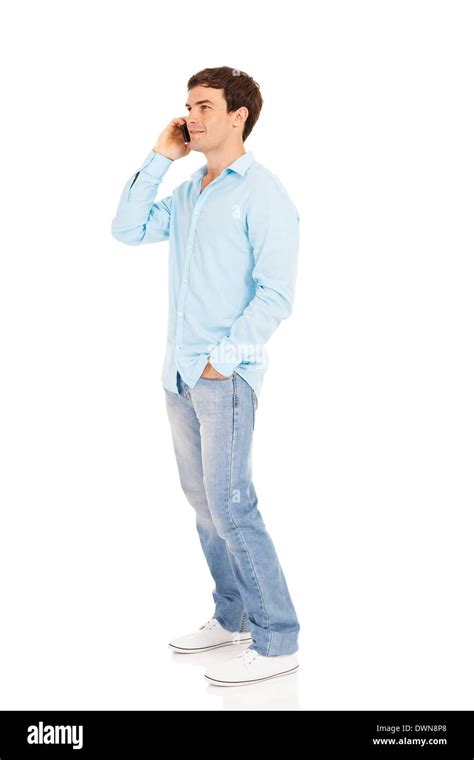 Side View Of Handsome Man Talking On Cell Phone On White Background