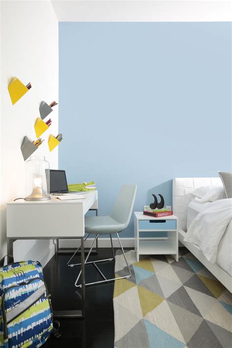 Kids` room in a blue color. Tidy Kid's Room With Study Area & Sky Blue Accent Wall | HGTV