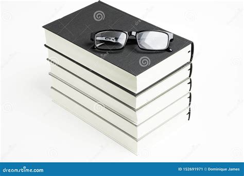 A Neatly Stacked Set Of Five Books With Reading Glasses Stock Image Image Of Imagination